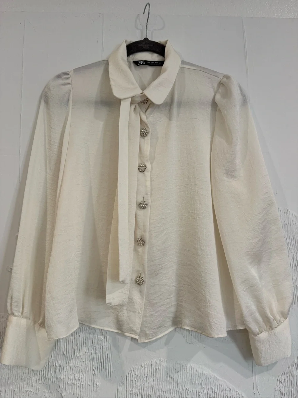 Zara Ivory Tie-Neck Blouse with Pearl Button Accents